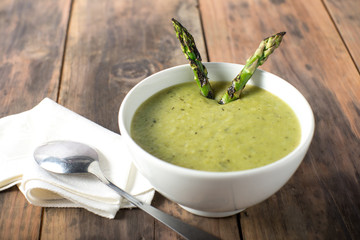 Wall Mural - White bowl of cream asparagus soup