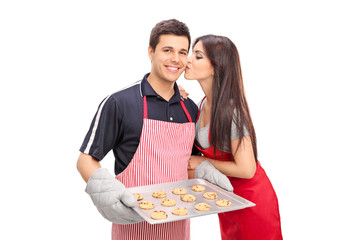 Wall Mural - Young couple baking cookies together