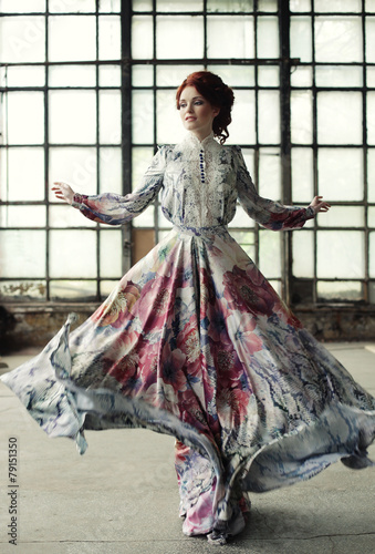 Obraz w ramie elegance woman with flying dress in palace room