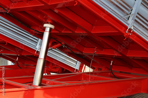 Fotografia, Obraz big Pneumatic cylinder below the truck in the yard