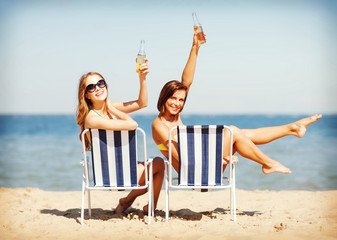 Poster - girls sunbathing on the beach chairs