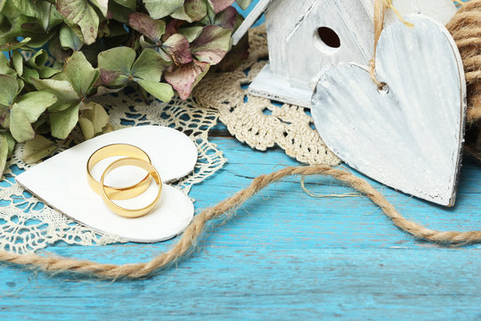 pair of wedding rings on old style background