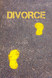 Yellow footsteps on sidewalk towards Divorce message