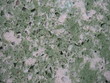 Grün-Weiß durchzogener Kunststein