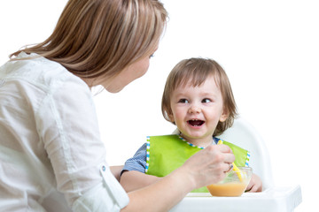 Wall Mural - mother feeding toddler boy