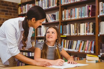 Poster - Teacher assisting girl with homework in library