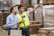 © WavebreakmediaMicro - Warehouse worker showing something to his manager