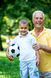 © .shock - grandfather and child have fun  in park
