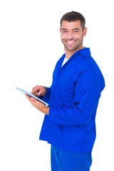 Poster - Happy male mechanic using tablet computer