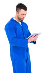 Poster - Happy mechanic using digital tablet