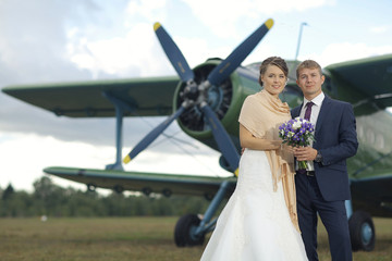 Wall Mural - Wedding couple in love vintage aircraft