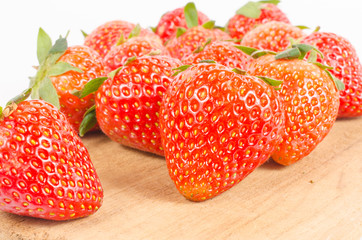 strawberries on wooden board