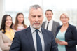 © Friends Stock - Businessman with his team standing behind