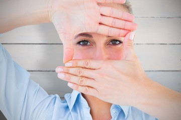 Poster - Composite image of pretty blonde making a hand gesture