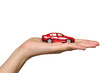 Women holds red car on the palm