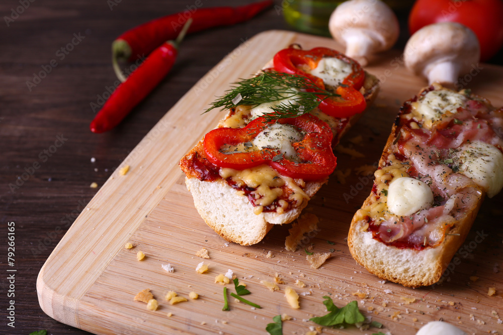 Different sandwiches with vegetables and cheese