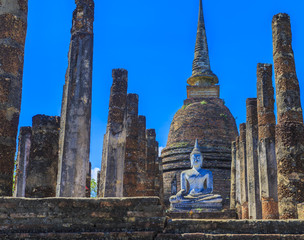 Ancient Buddha statue and pagodas  at Sukhothai Historical Park,