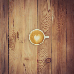 Wall Mural - Latte coffee on wood background and texture