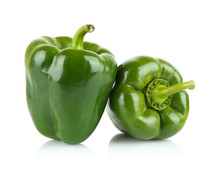 Close-up Shot Of Two Green Bell Peppers Isolated On White