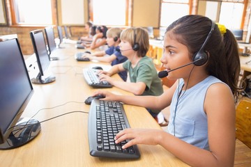 Cute pupils in computer class