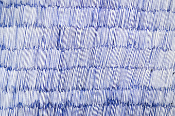 Blue ballpoint pen on white paper, texture or background