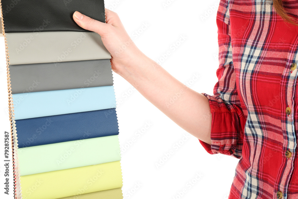 Female hand holding scraps of colored tissue close up