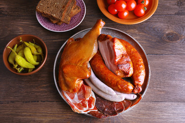 Poster - Assortment of deli meats on wooden background