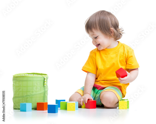 child boy playing wooden toys
