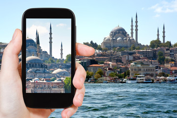 Poster - tourist taking photo of Istanbul skyline