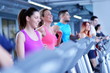 © .shock - Group of people running on treadmills