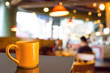 © coffmancmu - Empty wood table and Coffee shop blur background with bokeh imag
