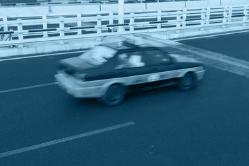 fast taxi on bridge