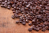 Fototapeta Boho - Coffee beans on wood background