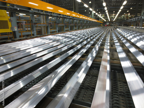 Fotografie, Obraz Aluminum lines on a conveyor belt in a factory.