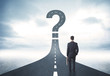 © ra2 studio - Business person lokking at road with question mark sign