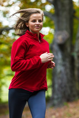 Wall Mural - Healthy lifestyle - woman running in park