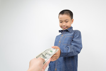 Young boy receive american bank note from hand