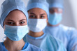 © lenets_tan - Surgeons team, wearing protective uniforms,caps and masks
