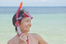 Woman With A Mask For Snorkeling In The Sea Background