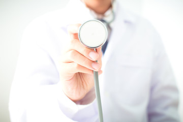 close up of male doctor holding x-ray or roentgen image