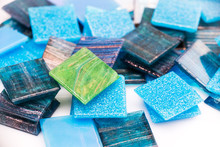 Stack Of Blue And Green Glass Mosaic Tiles On White Background