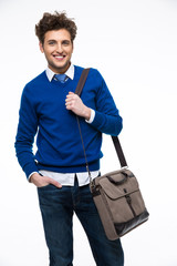 Wall Mural - Smiling young businessman with laptop bag over white background