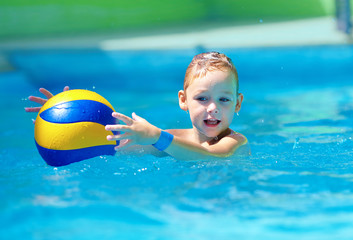 Wall Mural - cute kid playing water sport games in pool