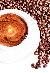 Poster - Coffee cup and roasted coffee beans isolated on a white backgrou