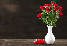 Bouquet Of Red Roses In White Vase With Hearts
