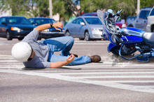 Motorcycle Wreck In Busy Intersection