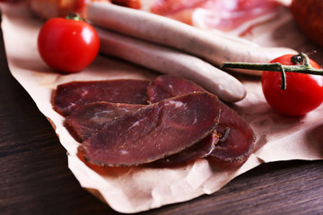 Poster - Assortment of deli meats on parchment, closeup