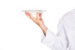 © Piotr Marcinski - Chef's hand holding white porcelain plate