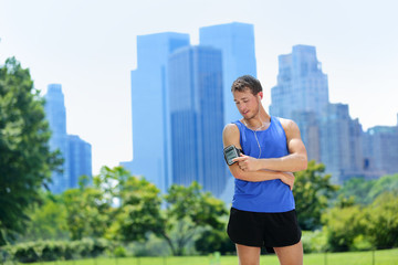 New York City runner listening music on smartphone