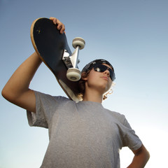 Wall Mural - Young boy with skateboard in hand